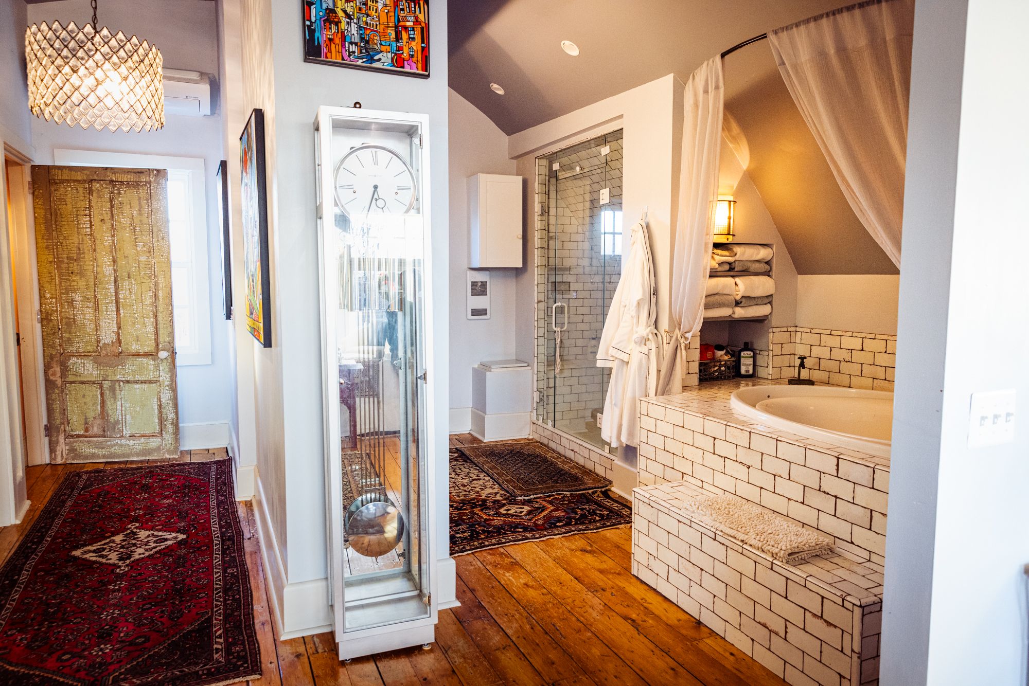 The suite's soaking tub and subway-tiled ensuite bath